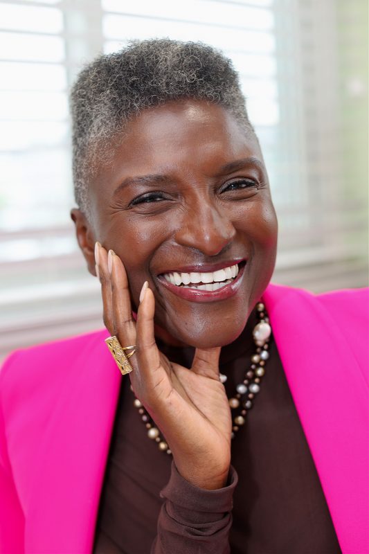 Studio portrait in a pink blazer